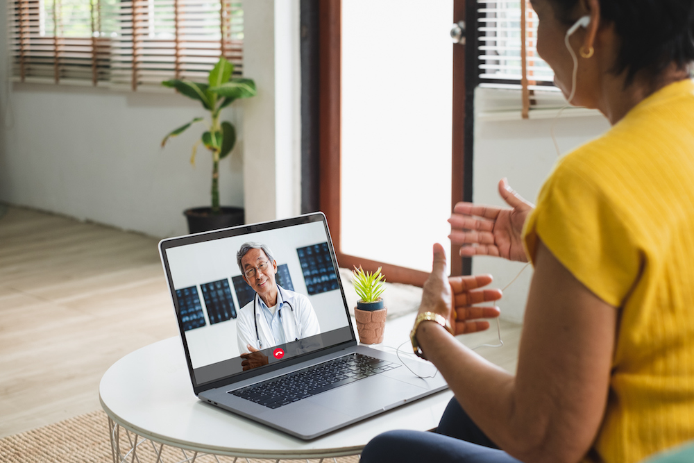 Asian senior video call with doctor telemedicine appointment